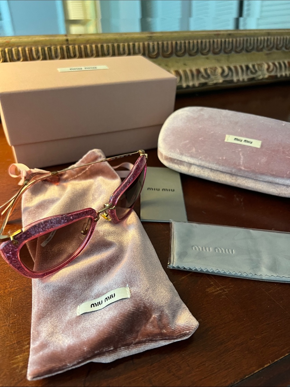 Miu Miu Glitter Pink Cat-Eye Sunglasses with Gold Hardware